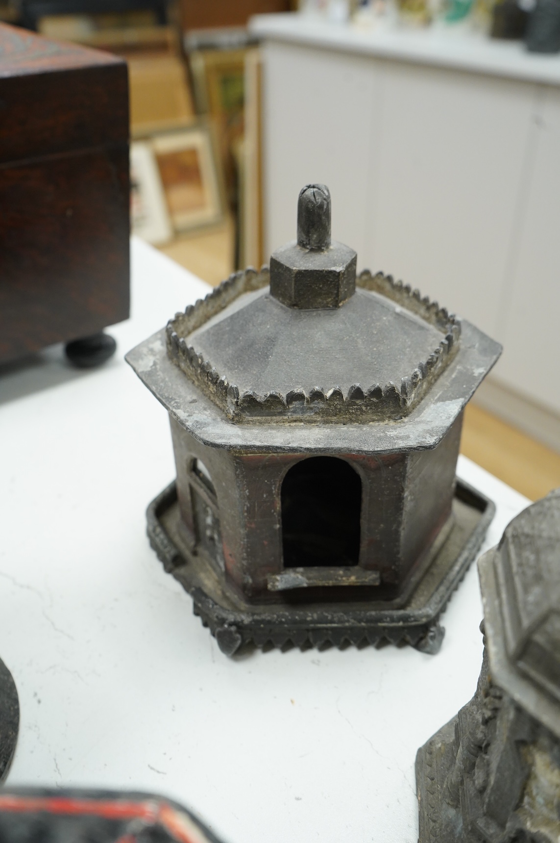 A collection of nine early 19th century lead tobacco boxes and a cover, tallest 20cm